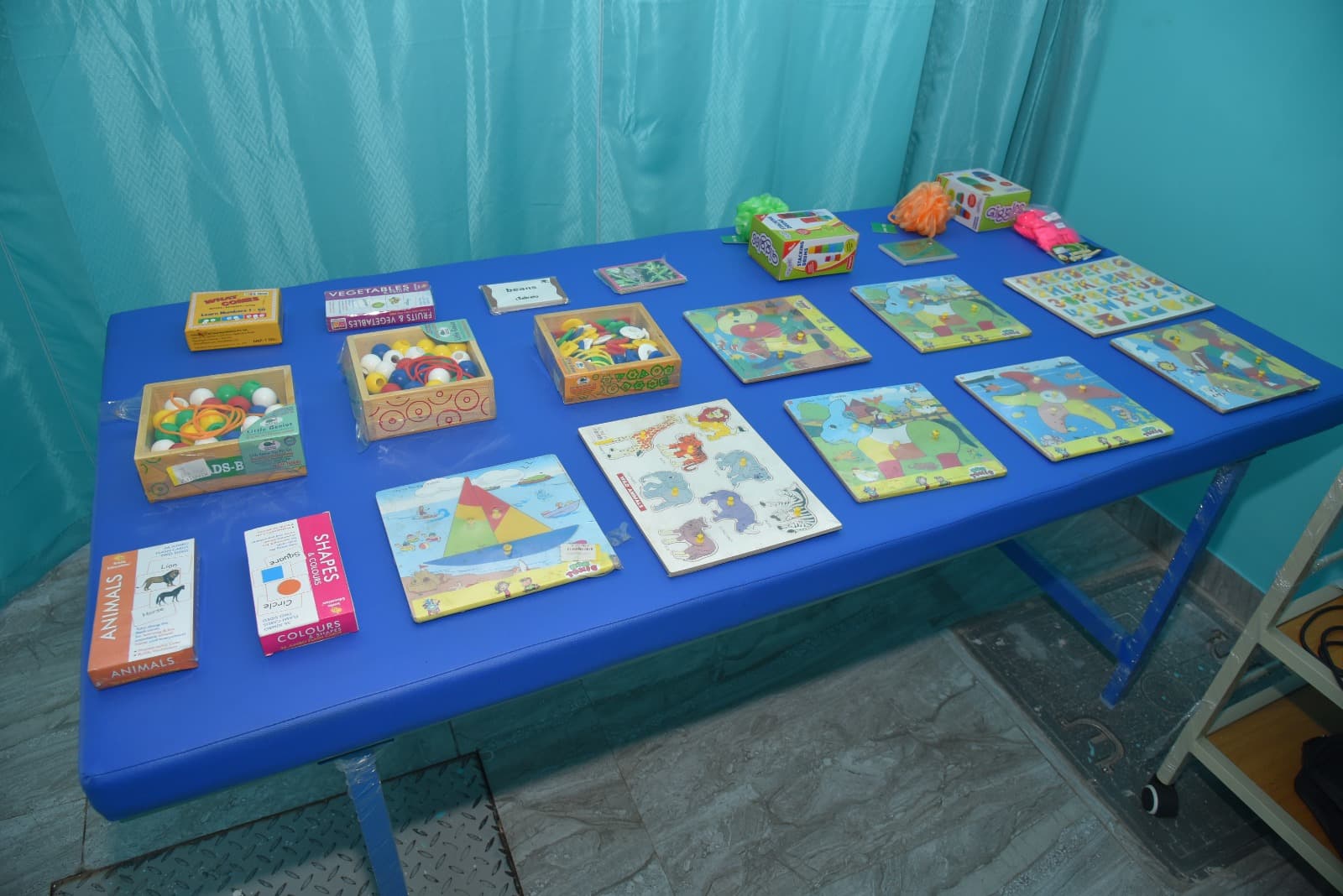 Wall busy board for fine motor training