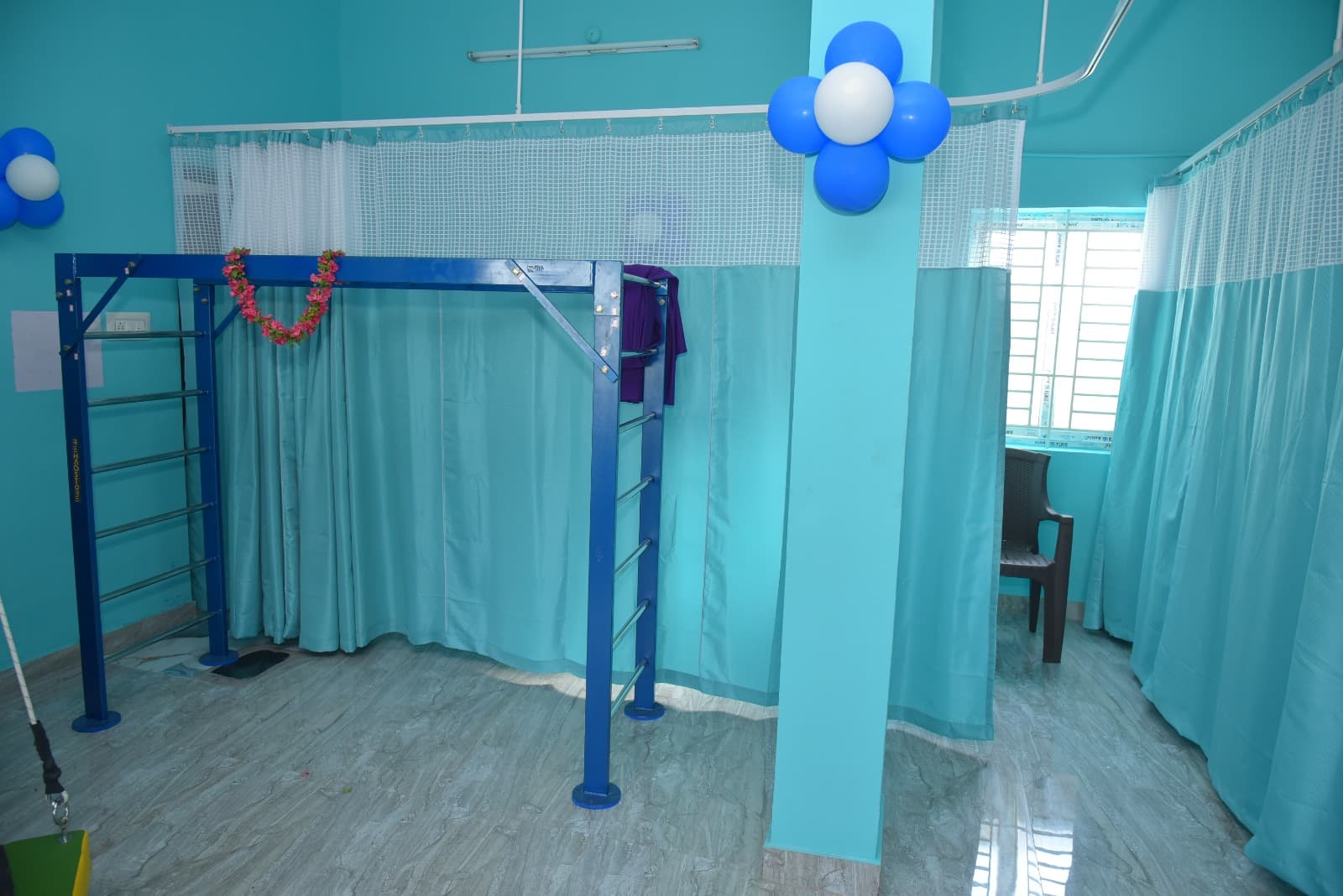 Bright clinic corridor leading to therapy spaces